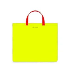CDG Super Fluo Tote Bag Yellow SA9000SF in glossy neon PVC with leather handles