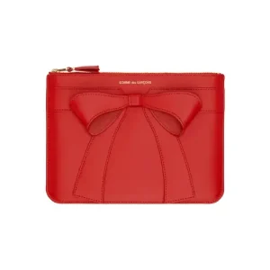 : COMME des GARÇONS Red Big Bow Pouch made from premium leather with oversized bow detail
